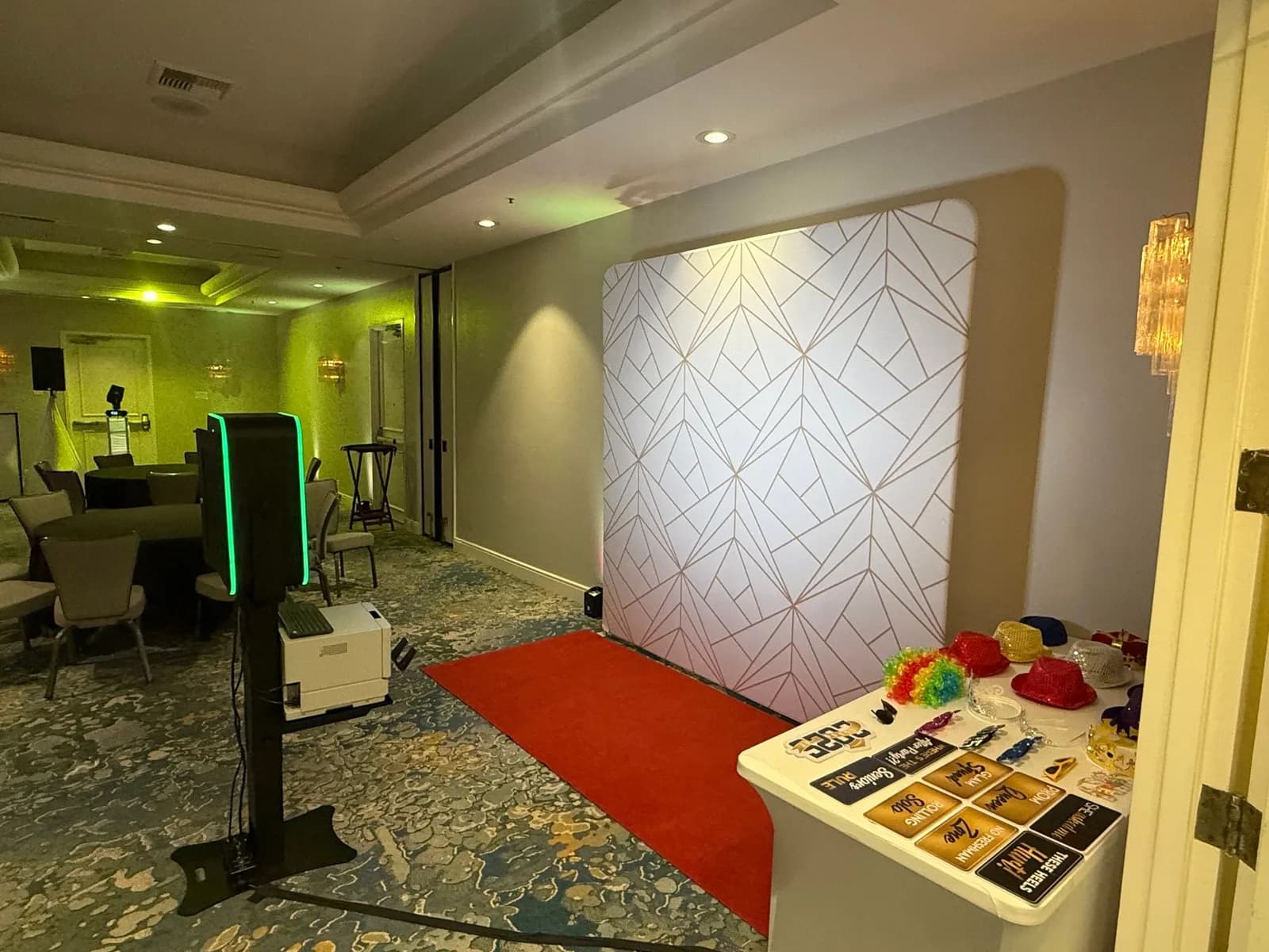 Digital photo booth setup with backdrop and lighting at a Central Coast event