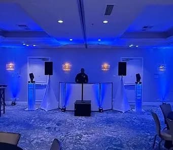 Blue uplighting in a ballroom reception