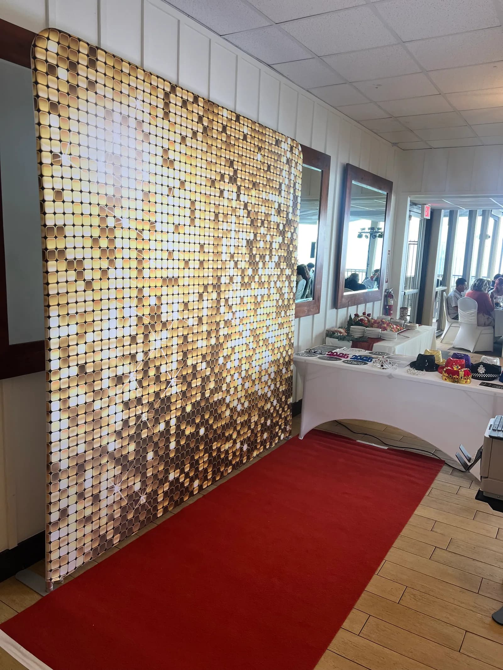 Gold shimmer wall backdrop with red carpet