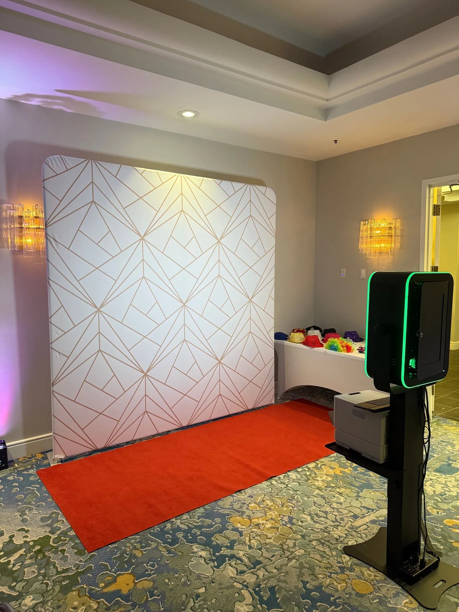 Open-air photo booth with white backdrop
